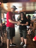Winner of 50/50 draw accepting prize